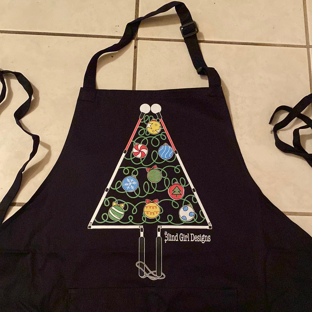 There is a large colorful print of a whimsical Christmas tree outlined by two blind canes, folded at the joints to make a triangle tree shape on the front of this black crew sweatshirt. The handles form the trunk and the roller balls form the outline of the top of the tree. The inside of the tree has green squiggles to suggest light strands with round red, yellow, white, and blue ornaments shaped like a roller ball on the bottom of a cane.