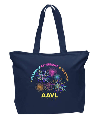This navy blue canvas zip tote The top of the print has the words CELEBRATE in teal, EXPERIENCE in pink, AND WISDOM in orange. The words are in a graceful arch. Beneath the words in the center of the print is a dynamic colorful fireworks display.  At the bottom of the print in 3D yellow puff ink are the letters AAVL and below that are the letters in tactile, readable braille.