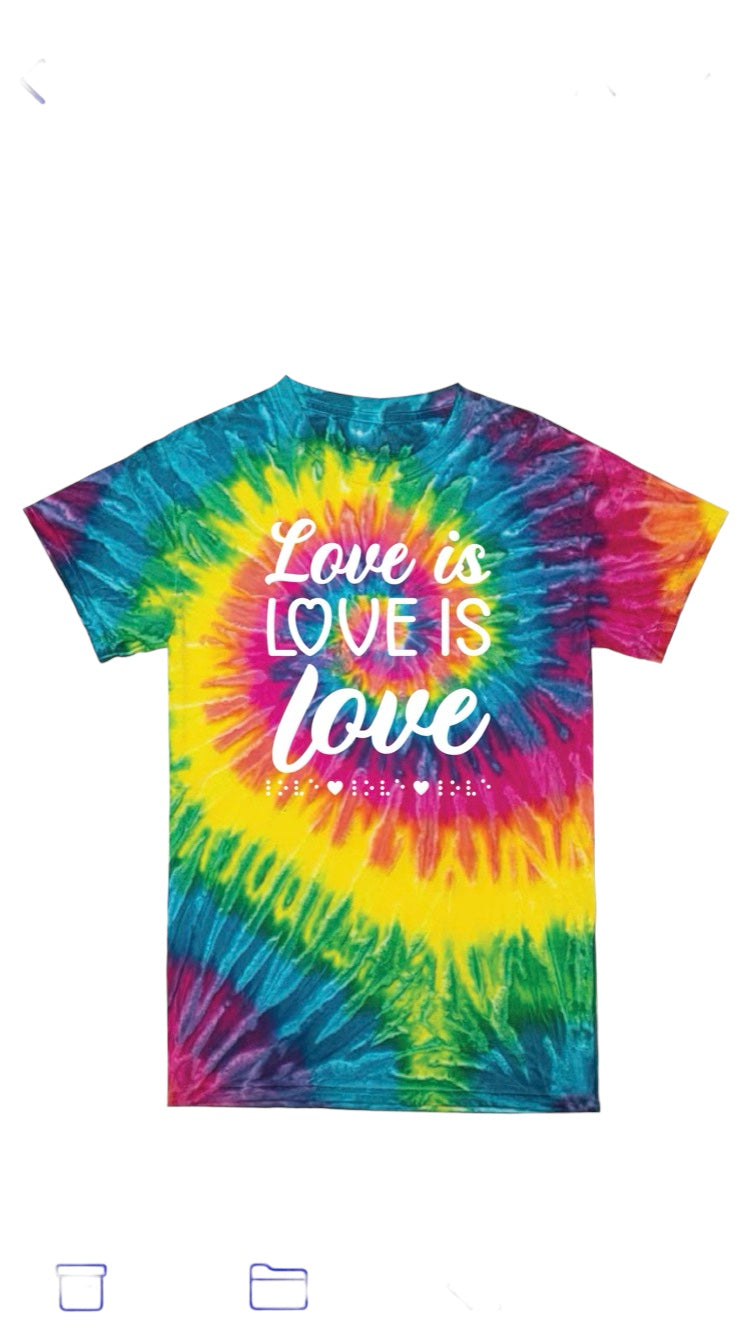 “Love is love is love” t-shirt with colorful rainbow of swirls tie dye. The shirt has 3D puff print ink reading LOVE IS LOVE IS LOVE stacked one above the other in two beautiful fonts, complete with 3D tactile braille underneath the font. 