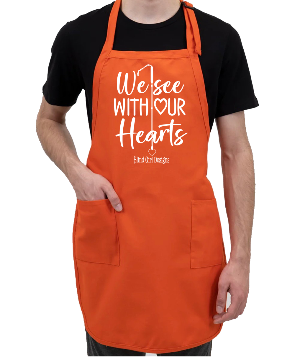 We See With Our Hearts whitecane  apron fun orange